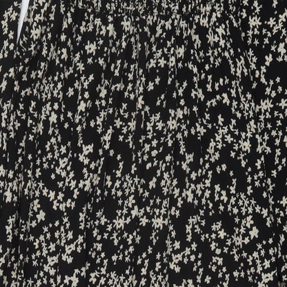 Brand and care label for Missguided women’s black floral polyester a-line, size UK 8, square neck pullover