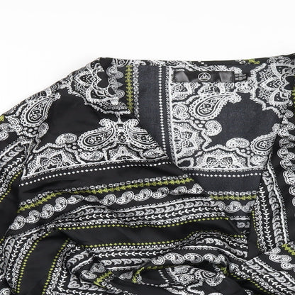 Close-up detail of Missguided women’s black geometric polyester basic blouse, size UK 10, v-neck