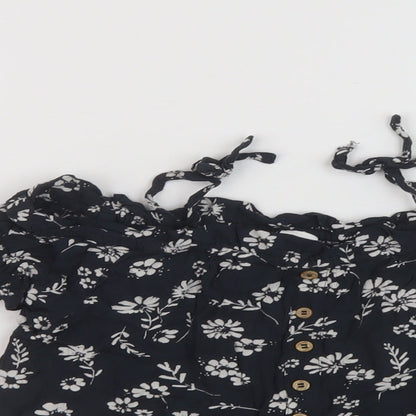 Close-up detail of Next girls’ black floral viscose basic blouse, size 6, years square neck pullover