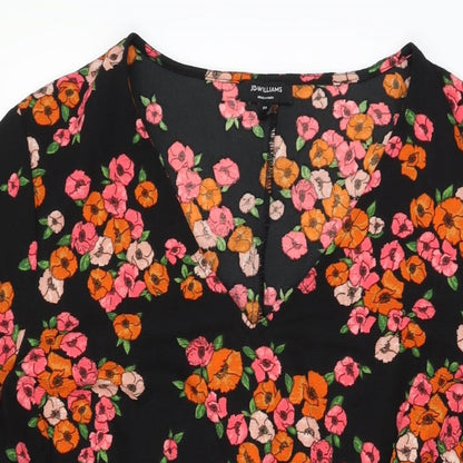 Close-up detail of JD Williams women’s black floral polyester a-line, size UK 20, v-neck pullover