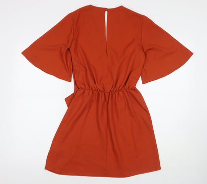 Back view of Miss Selfridge women’s orange polyester a-line, size UK 4, v-neck button