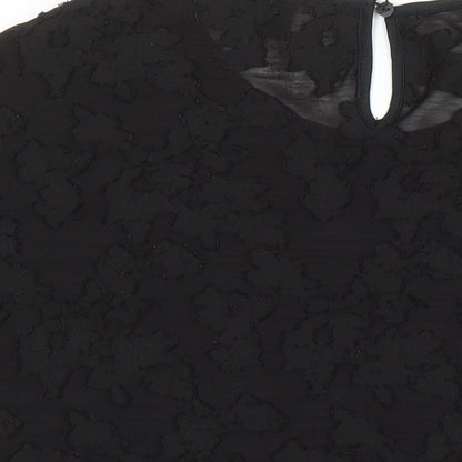 Brand and care label for ESPRIT women’s black polyester tunic blouse, size L, round neck