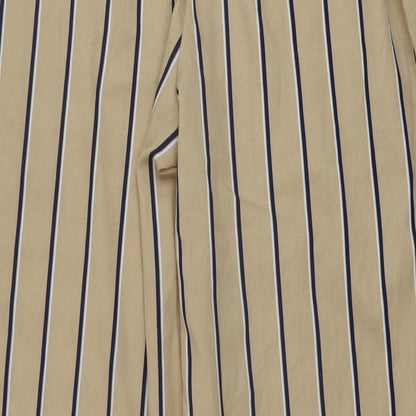 Brand and care label for Missguided women’s beige striped polyester trousers, size UK 6, 31-inch leg regular