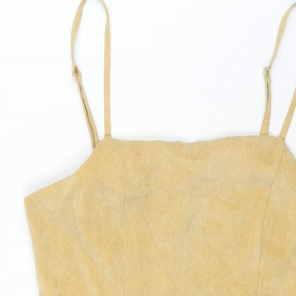 Close-up detail of Cooperative women’s yellow cotton mini, size M, square neck zip
