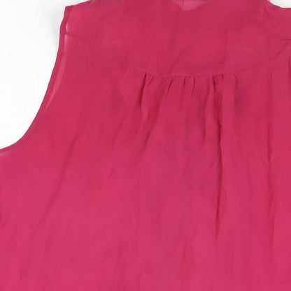 Brand and care label for Miss Selfridge women’s pink polyester basic button-up, size UK 10, collared