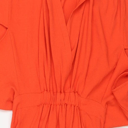 Close-up detail of ASOS women’s orange polyester a-line, size UK 8, v-neck pullover