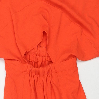 Brand and care label for ASOS women’s orange polyester a-line, size UK 8, v-neck pullover