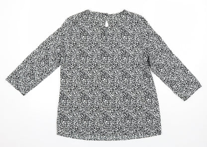 Back view of Dunnes women’s ivory geometric polyester tunic blouse, size XS, round neck