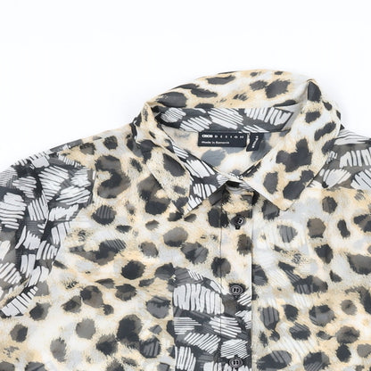 Close-up detail of ASOS women’s multicoloured animal print polyester basic button-up, size UK 10, collared