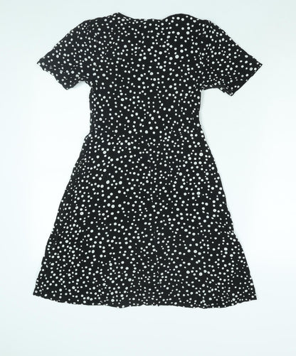 Back view of ASOS women’s black polka dot viscose a-line, size UK 10, round neck pullover