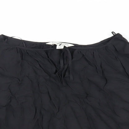 Close-up detail of Autograph women’s black cupro basic blouse, size UK 14, round neck