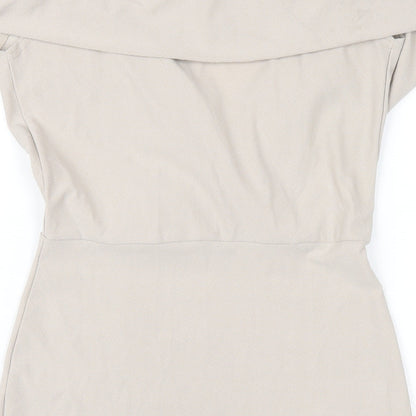 Brand and care label for Missguided women’s beige polyester bodycon, size UK 10, off the shoulder pullover