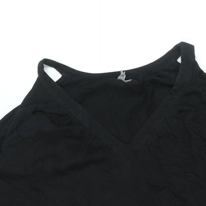 Close-up detail of ASOS women’s black polyester mini, size UK 8, v-neck pullover - cold shoulder