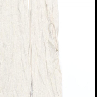 Close-up detail of ASOS women’s beige viscose mini, size UK 10, halter zip