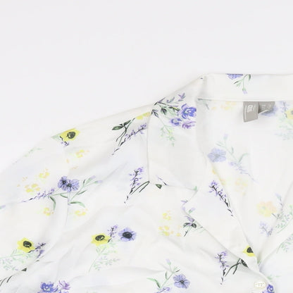 Close-up detail of ASOS women’s white floral polyester basic button-up, size UK 12, collared