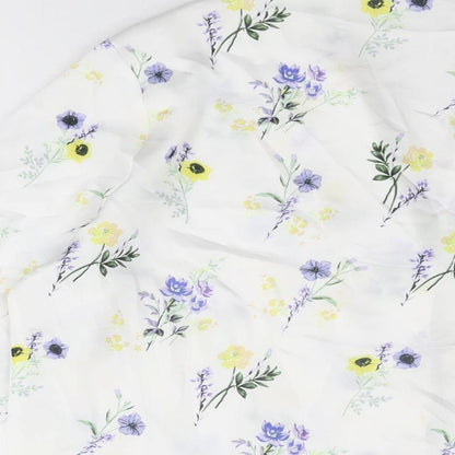 Brand and care label for ASOS women’s white floral polyester basic button-up, size UK 12, collared