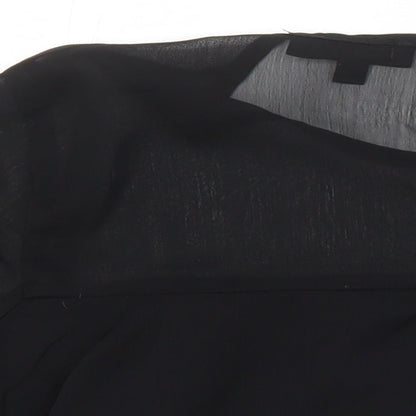 Brand and care label for Missguided women’s black polyester cropped blouse, size UK 10, round neck