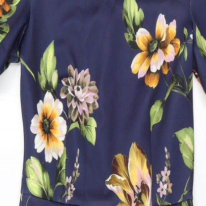 Close-up detail of ASOS women’s blue floral polyester bodycon, size UK 10, round neck zip