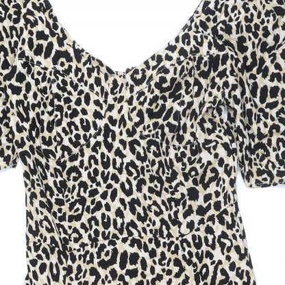 Close-up detail of ASOS women’s beige animal print polyester a-line, size UK 8, scoop neck button