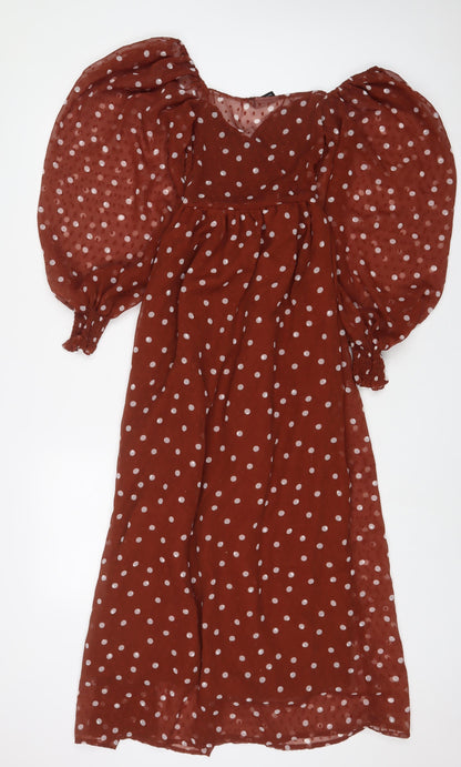 Back view of ASOS women’s brown polka dot polyester a-line, size UK 6, v-neck pullover