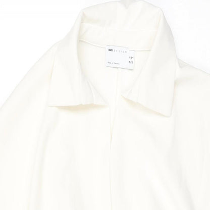 Close-up detail of ASOS women’s white polyester shift, size UK 10, collared pullover