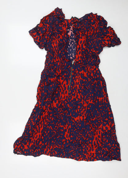 Back view of ASOS women’s red geometric viscose a-line, size UK 16, round neck zip