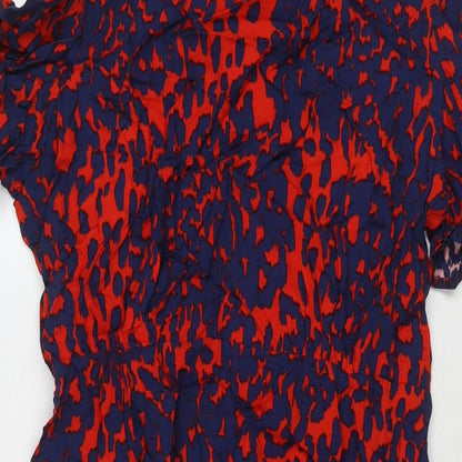 Close-up detail of ASOS women’s red geometric viscose a-line, size UK 16, round neck zip