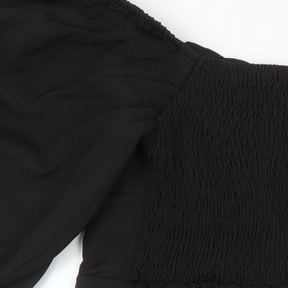 Brand and care label for Missguided women’s black polyester shift, size UK 8, boat neck