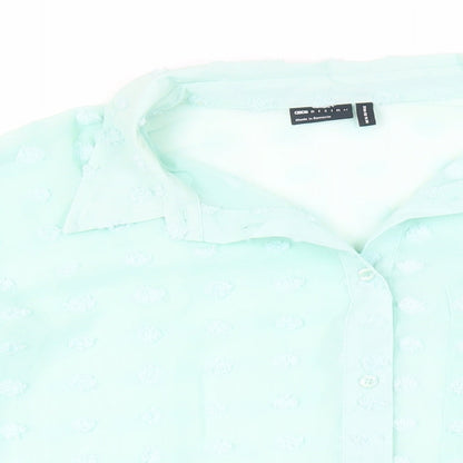 Close-up detail of ASOS women’s green polyester basic button-up, size UK 16, collared - oversized sheer textured