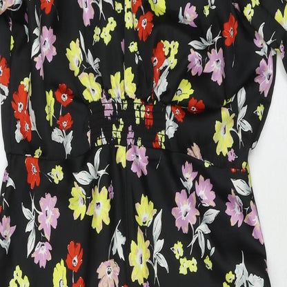 Close-up detail of ASOS women’s black floral polyester maxi, size UK 10, round neck zip