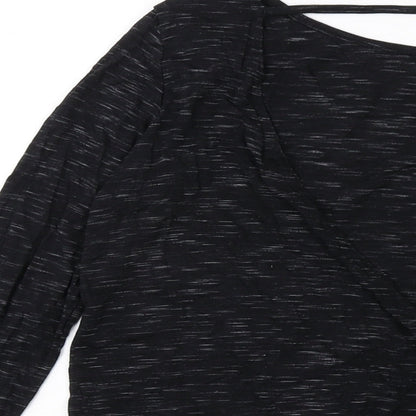 Brand and care label for Missguided women’s black polyester basic blouse, size UK 14, round neck