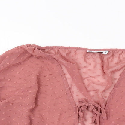 Close-up detail of ASOS women’s pink polyester basic blouse, size UK 6, v-neck