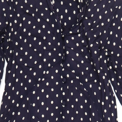 Close-up detail of ASOS women’s blue polka dot viscose a-line, size UK 8, v-neck button