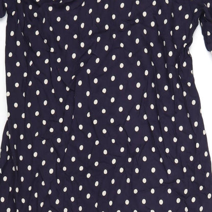 Brand and care label for ASOS women’s blue polka dot viscose a-line, size UK 8, v-neck button