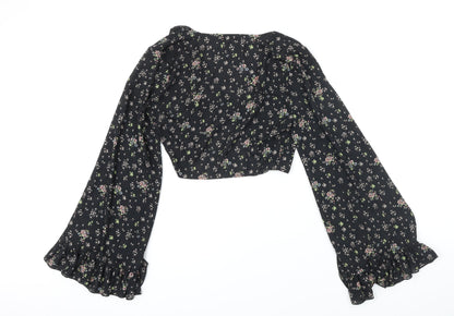 Back view of Missguided women’s black floral polyester cropped blouse, size UK 8, v-neck