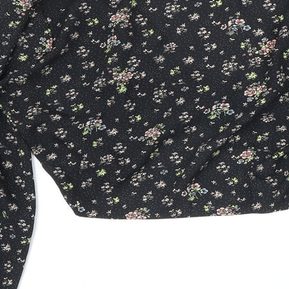 Brand and care label for Missguided women’s black floral polyester cropped blouse, size UK 8, v-neck