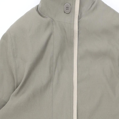 Close-up detail of NuAge women’s beige overcoat coat, size UK 8, button