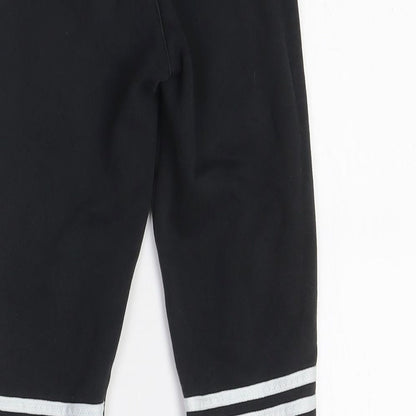 Brand and care label for Adidas boys’ black jogger trousers with side stripe
