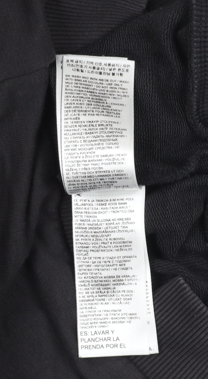 Close-up detail of Puma boys’ black logo sweatshirt 13-14 years