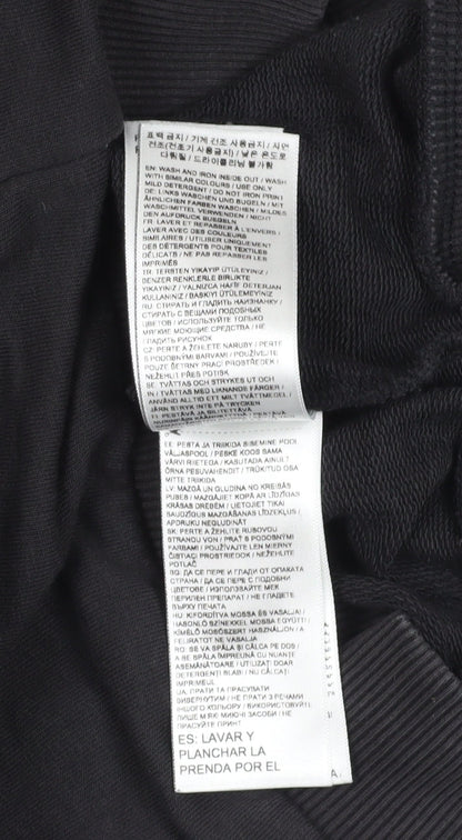 Close-up detail of Puma boys’ black logo sweatshirt 13-14 years
