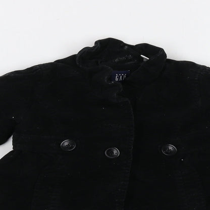 Close-up detail of Gap girls’ black jacket, size 2, years button