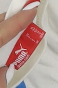 Close-up detail of Puma boys’ white graphic print t-shirt xs regular fit