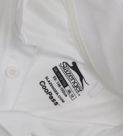 Close-up detail of Slazenger boys’ white polo shirt, age 11-12, logo accent