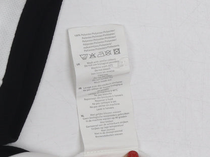 Brand and care label for Slazenger boys’ white polo shirt, age 11-12, logo accent