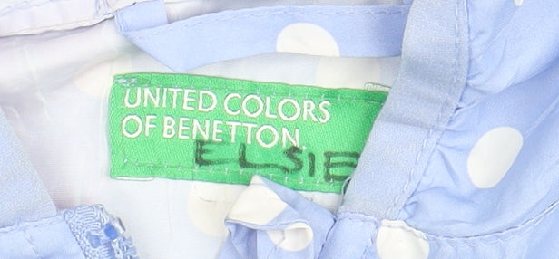Close-up detail of Benetton girls’ blue polka dot windbreaker jacket 3-4 years