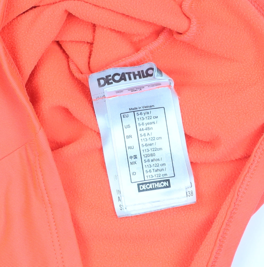 Close-up detail of Decathlon girls’ orange 1/4 zip sweatshirt, 5-6 years, lightweight