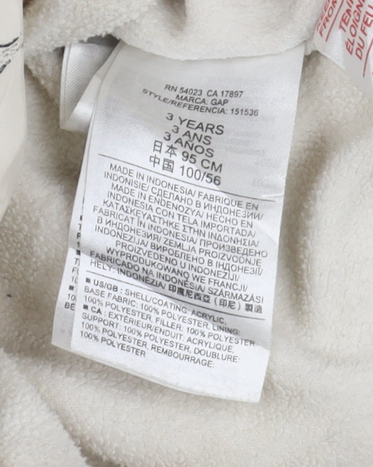 Brand and care label for Baby Gap girls’ ivory animal print puffer jacket, size 3