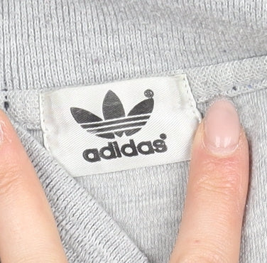 Close-up detail of Adidas men’s grey polo shirt m solid casual