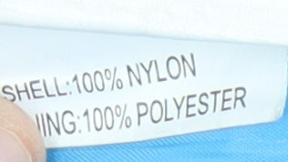 Brand and care label for Ticket to Heaven boys’ blue hooded jacket 2 years