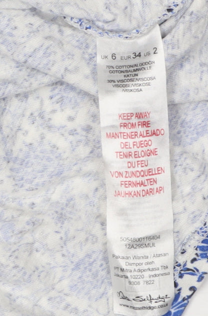 Close-up detail of Miss Selfridge Women's Blue Floral Blouse, size 6
